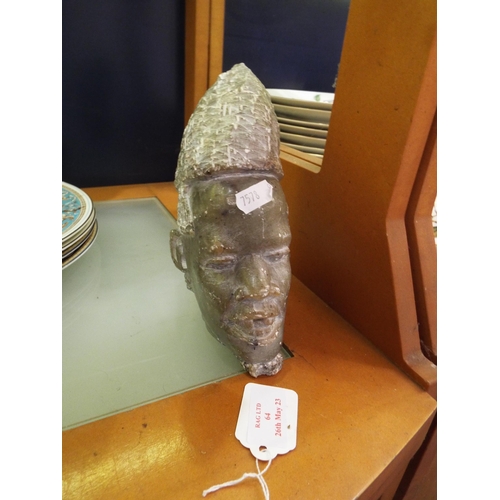 64 - A carved soapstone African head signed to base