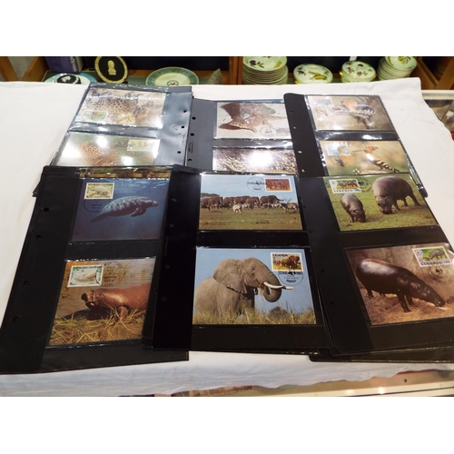 76 - A box of twenty two animal sets of four stamped postcards