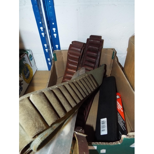 353 - A selection of shotgun cartridge belts and gun cleaning kit