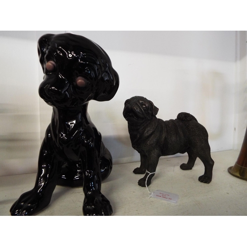 371 - A Torquay pottery black glazed dog and a resin figure of a pug