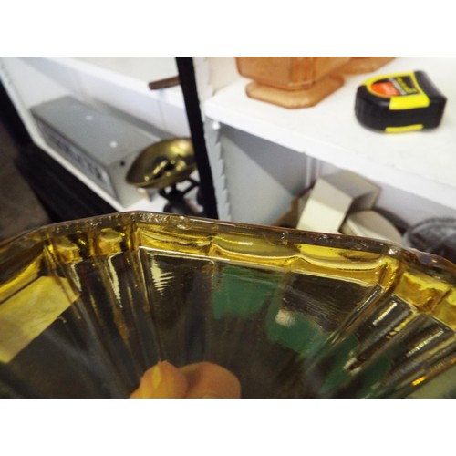 387 - A pair of amber glass art deco lidded jars with embossed female decoration