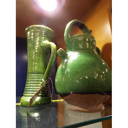 102 - Two green glazed pottery vases