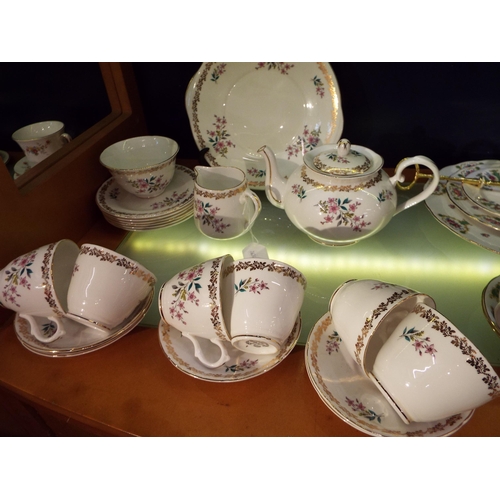 61 - A Royal Grafton bone china tea-set comprising of cups, saucers, cake plates, tea-pot, sugar bowl and... 