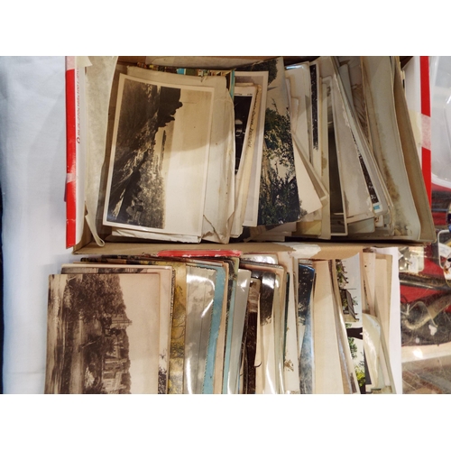 86 - A box of assorted vintage postcards