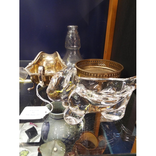 92 - A French glass cat paperweight, chandelier, flute, silver-plated sauce boat and coaster