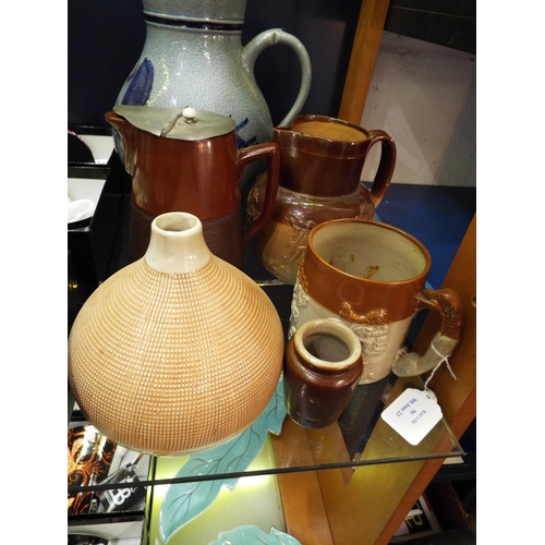 96 - A Doulton Lambeth water jug, a hot water jug, large blue glazed water jug, an onion shaped vase etc