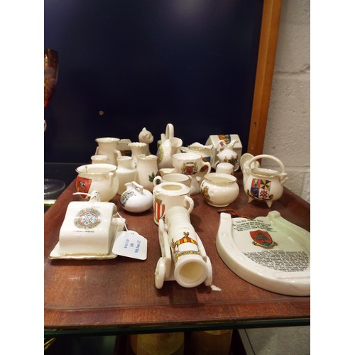 106 - A mixed selection of crested-ware to include horse shoe, canon, cheese dish, vases etc
