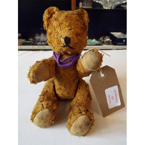 125 - A vintage jointed teddy bear