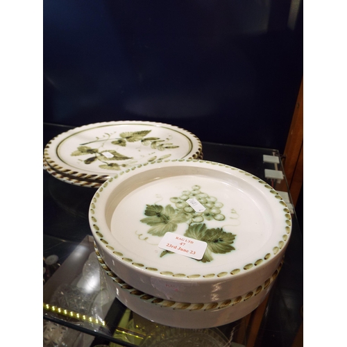 47 - Two Rye pottery dinner plates and two shallow bowls with hop and vine decoration