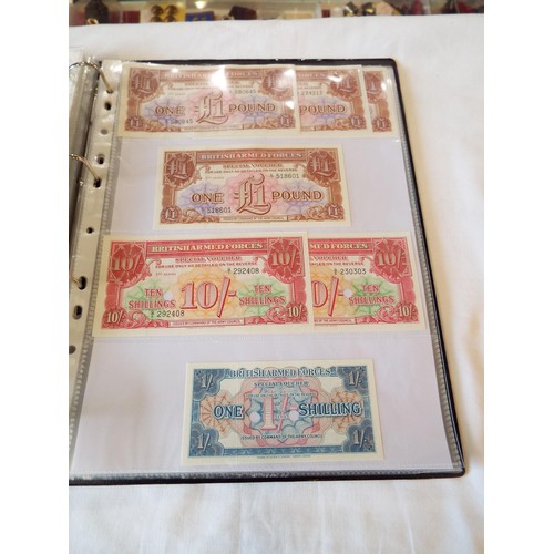 151 - An album of WWII banknotes and tokens to include rare Belgium example, Belgium government in exile n... 