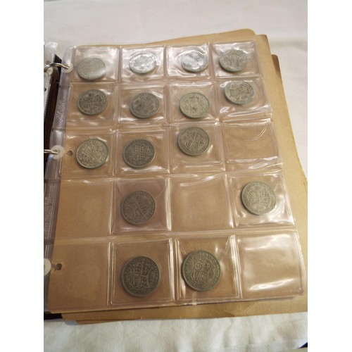 166 - An album of coins to include half crowns, florins, crowns, two shillings, some Victorian examples, o... 