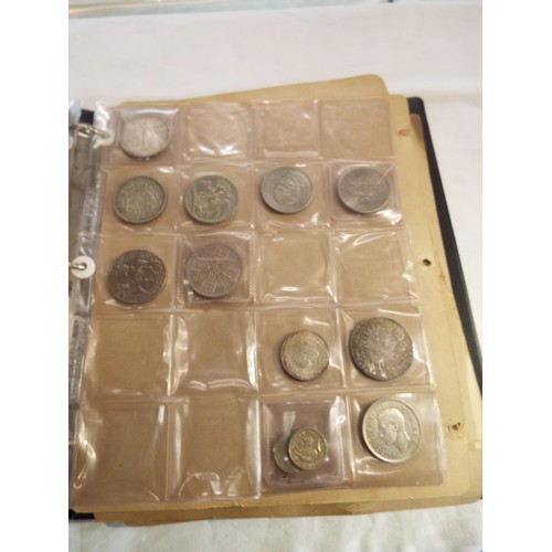 166 - An album of coins to include half crowns, florins, crowns, two shillings, some Victorian examples, o... 