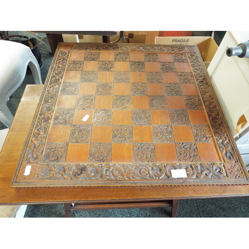 521 - A large carved oak chess board