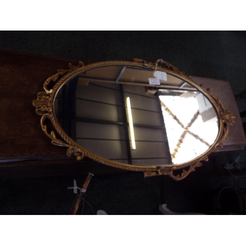 525 - A gilt framed oval mirror