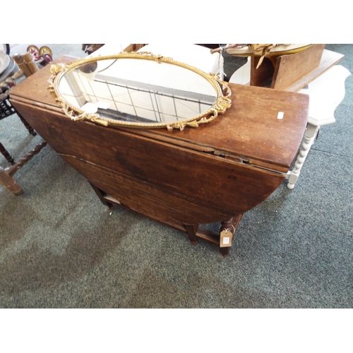 526 - An early oak gateleg table with turned leg and a drawer