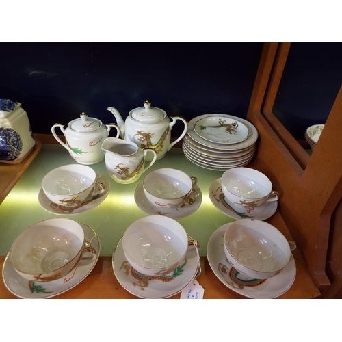47 - An Oriental Chinese tea-set comprising of tea-pot, plates, cups, saucers, sugar bowl and milk jug