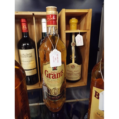 124 - A 1 litre bottle of Grants Whisky