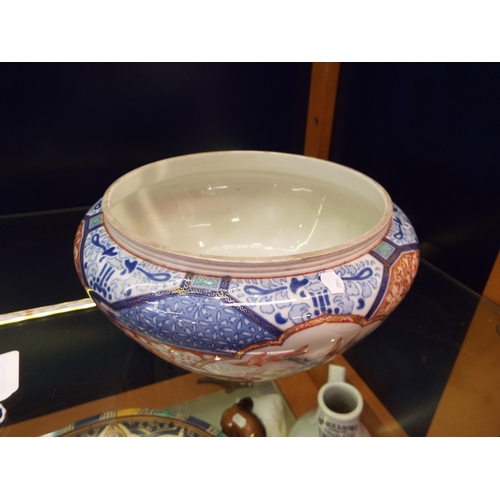 13 - A Japanese Imari patterned china bowl having fish, birds and floral decoration