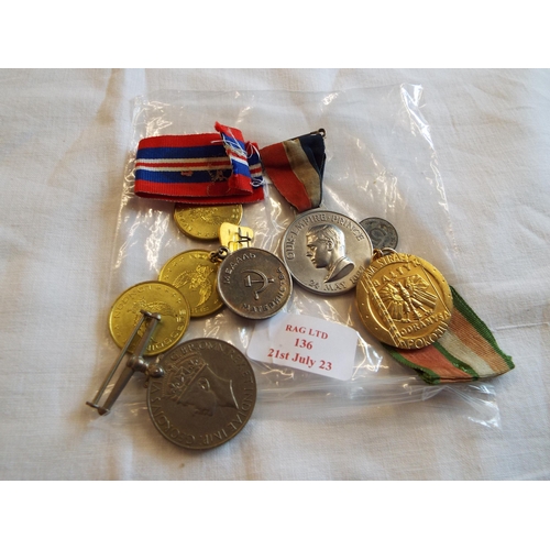 136 - A mixed selection of military medals to include Russian, British etc