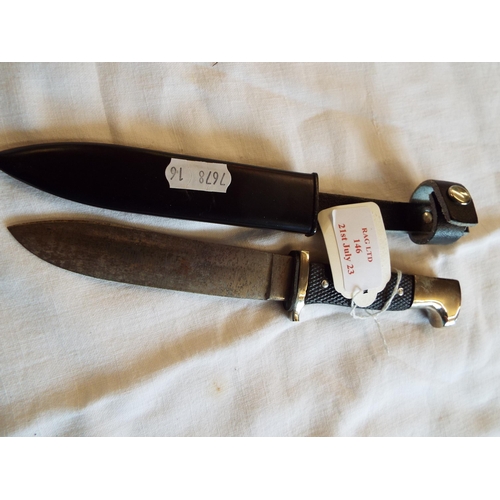 146 - A vintage German Scout knife in metal scabbard