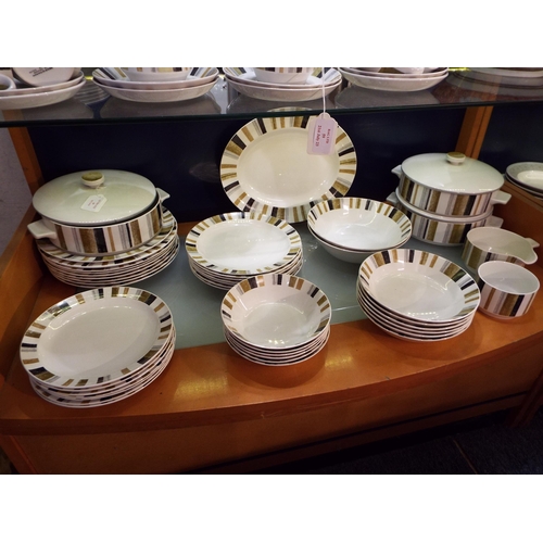 60 - A large selection of retro Midwinter dinner ware to include tureens, dinner plates, meat platter, bo... 