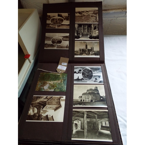 94 - An album housing a selection of assorted postcards to include scenic, architectural etc