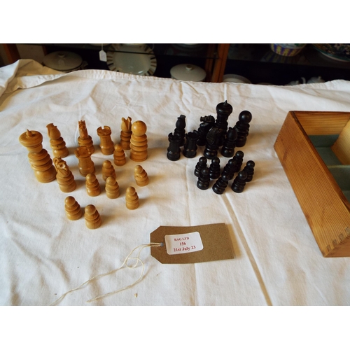 156 - A set of wooden chess pieces housed in a pine box