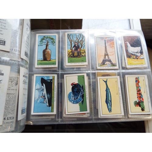 93A - An album housing a selection of cigarette cards to include British Birds, Garden Flowers etc