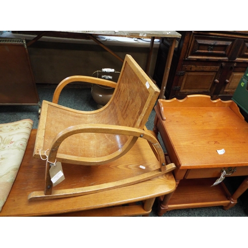 590 - A vintage child's wooden rocking chair