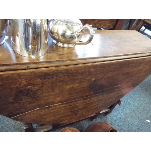 603 - An early oak gateleg table with turned leg and a drawer