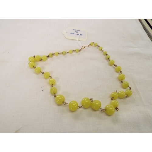 243 - A rosary strung beaded necklace