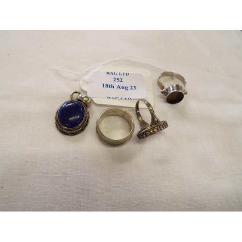 252 - A silver pendant drop together with silver rings