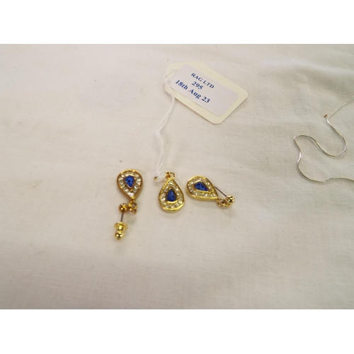 295 - A pair of gold tone earring inset with blue stone and matching pendant
