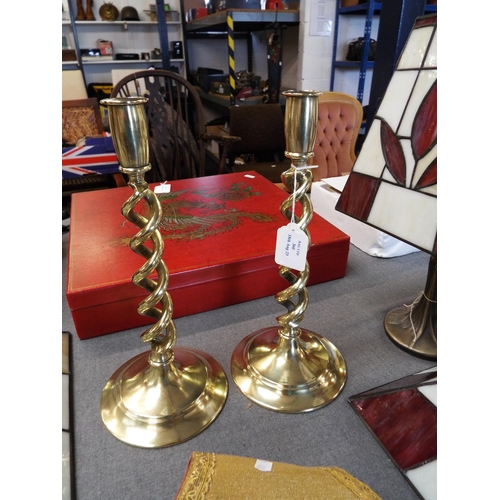 360 - A pair of brass barley twist candlesticks