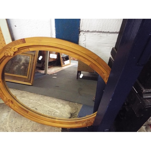 494 - A pine framed oval mirror