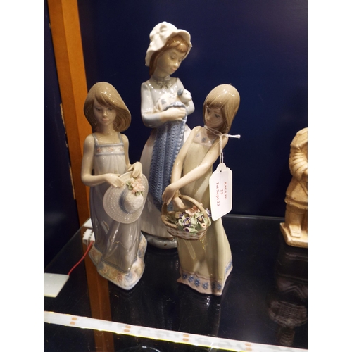 29 - Two LLadro figurines of young girls and a Nao figurine