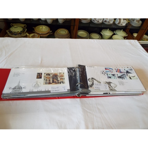 73 - An album housing a selection of British First Day covers