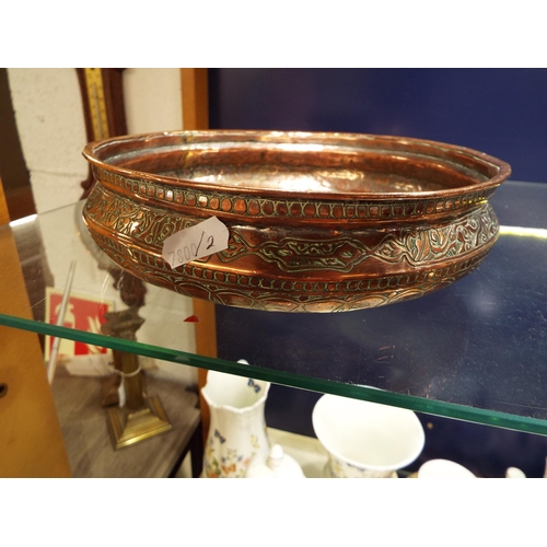 125 - A Middle Eastern possibly Persian copper bowl with engraved decoration