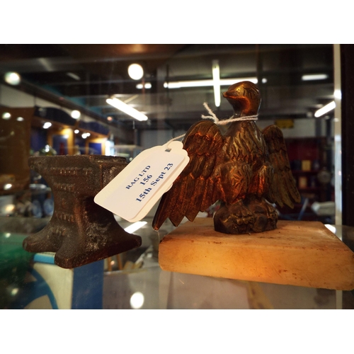 156 - A vintage bronze sample anvil and a brass eagle on marble base