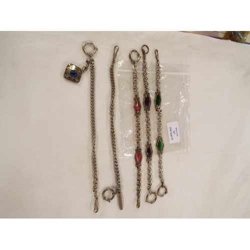 167 - A selection of white metal Albert chains