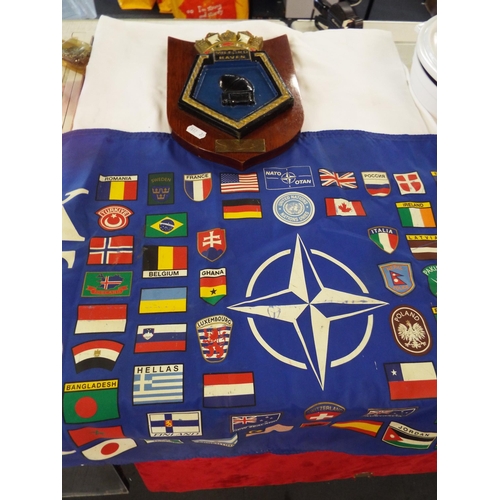 173 - A wooden ships plaque and a U.N. flag