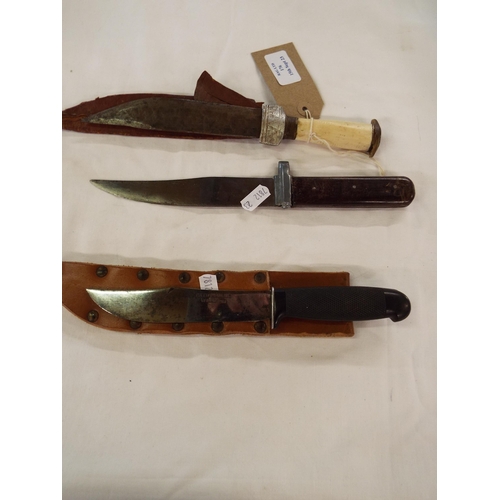 176 - Three vintage sheath knives