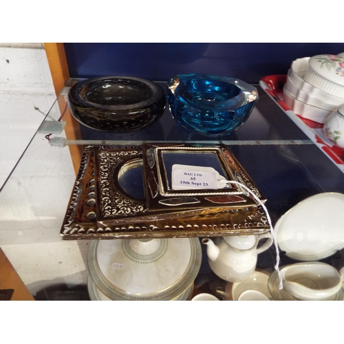 65 - Four brass framed Indian small mirrors together with two glass vintage ashtrays