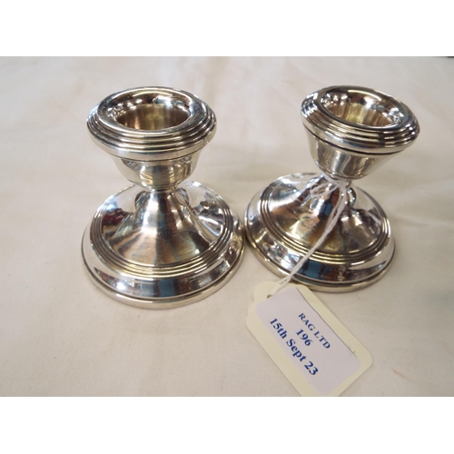 196 - A pair of Birmingham 1968 silver squat candlesticks