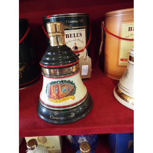 248 - A unopened Extra Special Bells Whisky decanter commemorating Christmas 1991 housed in a tin