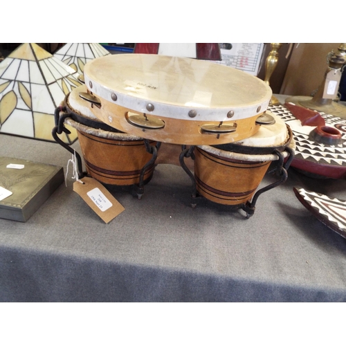 268 - A vintage set of bongo drums together with a tambourine