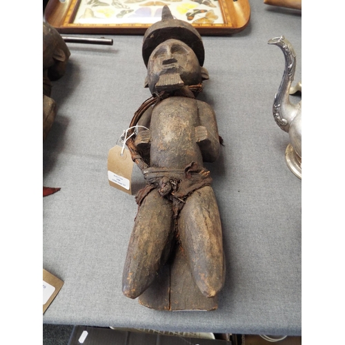 288 - A late 19th early 20thC large carved wooden statuette from Gabon the former French Colony wearing a ... 