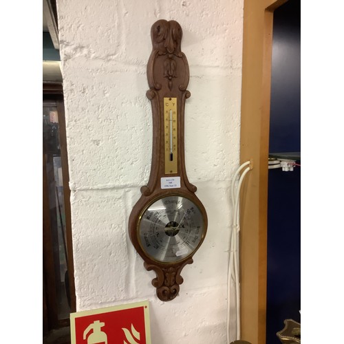 340 - A carved oak wall hanging Weathermaster banjo barometer