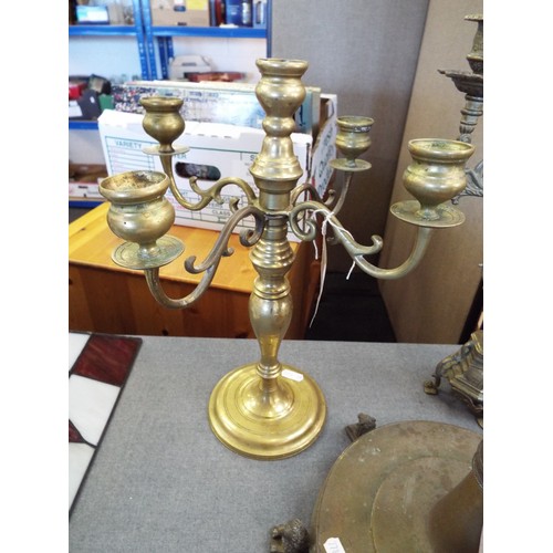 267 - Two ornate brass candelabras