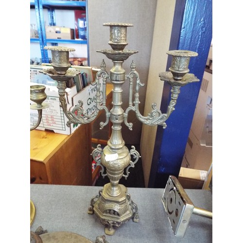 267 - Two ornate brass candelabras